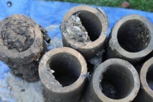 Clogged clay weeping tile removed following foundation excavation