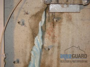 Injected polyurethane oozing out of an injected foundation crack