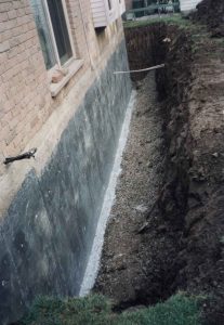 Image of excavated foundation wall as part of exterior basement waterproofing