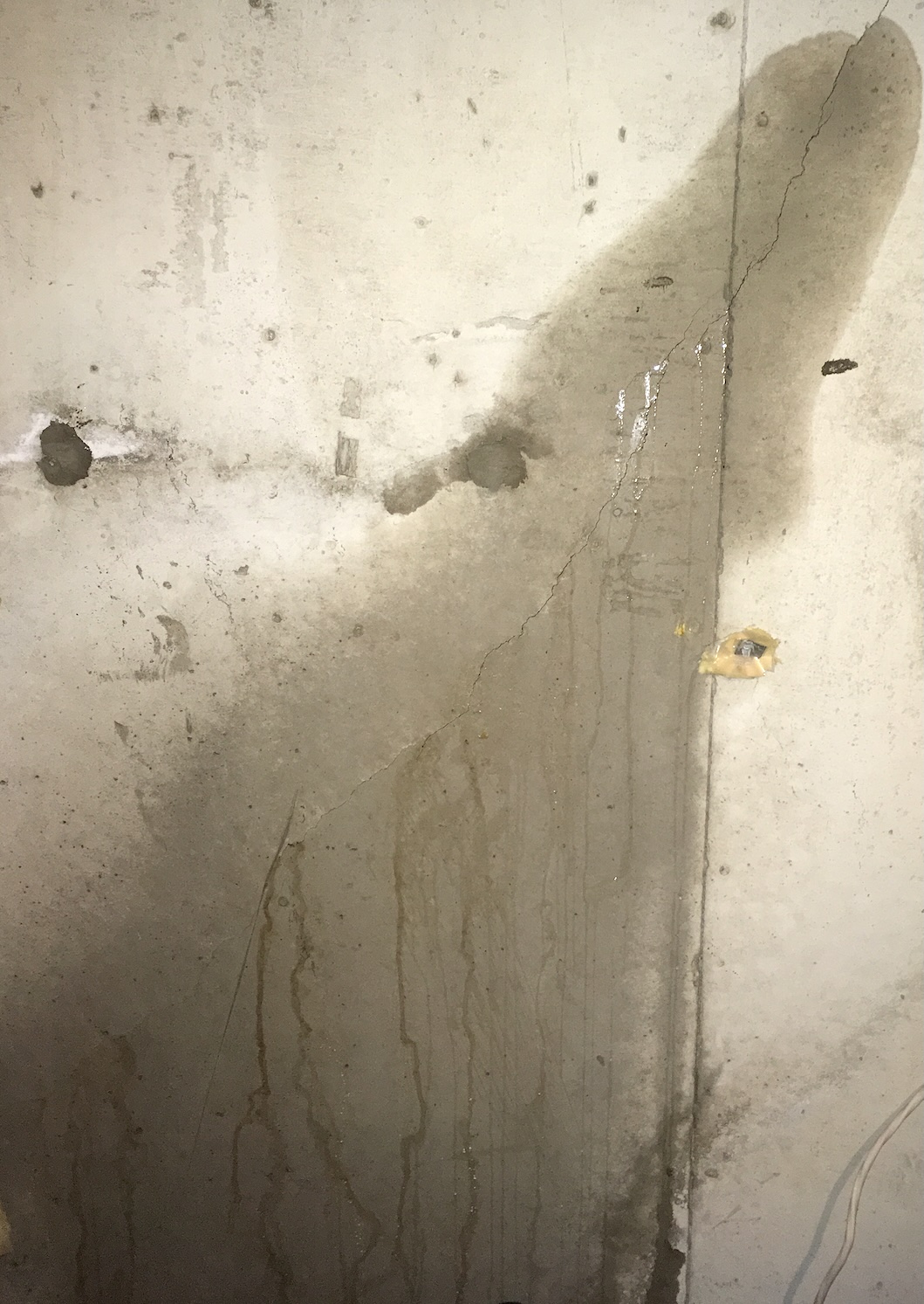 Active water leak through diagonal foundation wall crack