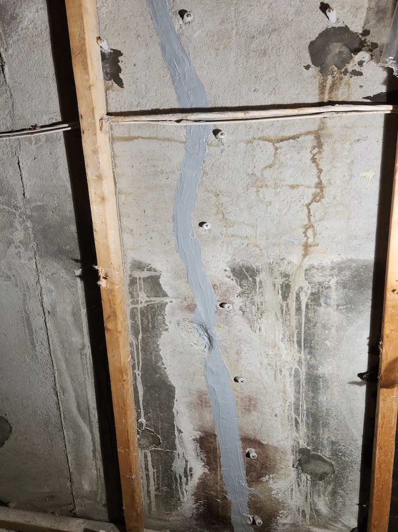 Foundation crack sealed with epoxy paste and injection packers installed
