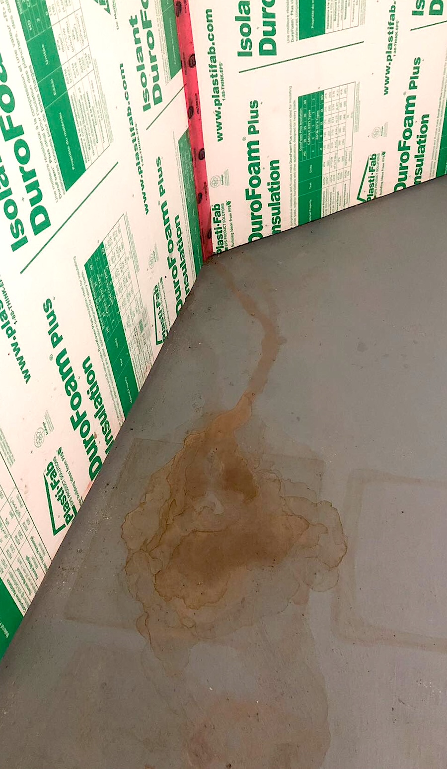 Water leaking onto basement floor from behind finished basement wall