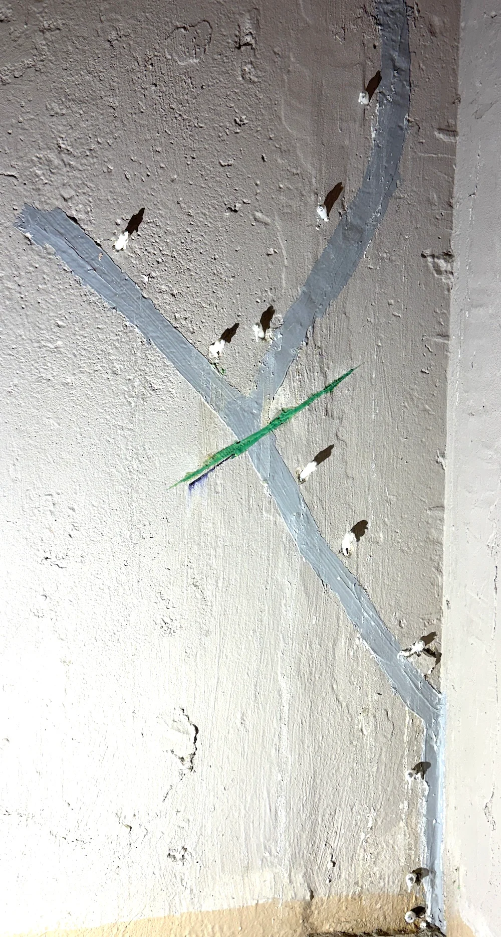 Carbon fibre stitch installed across a repaired foundation crack to help prevent further crack movement.