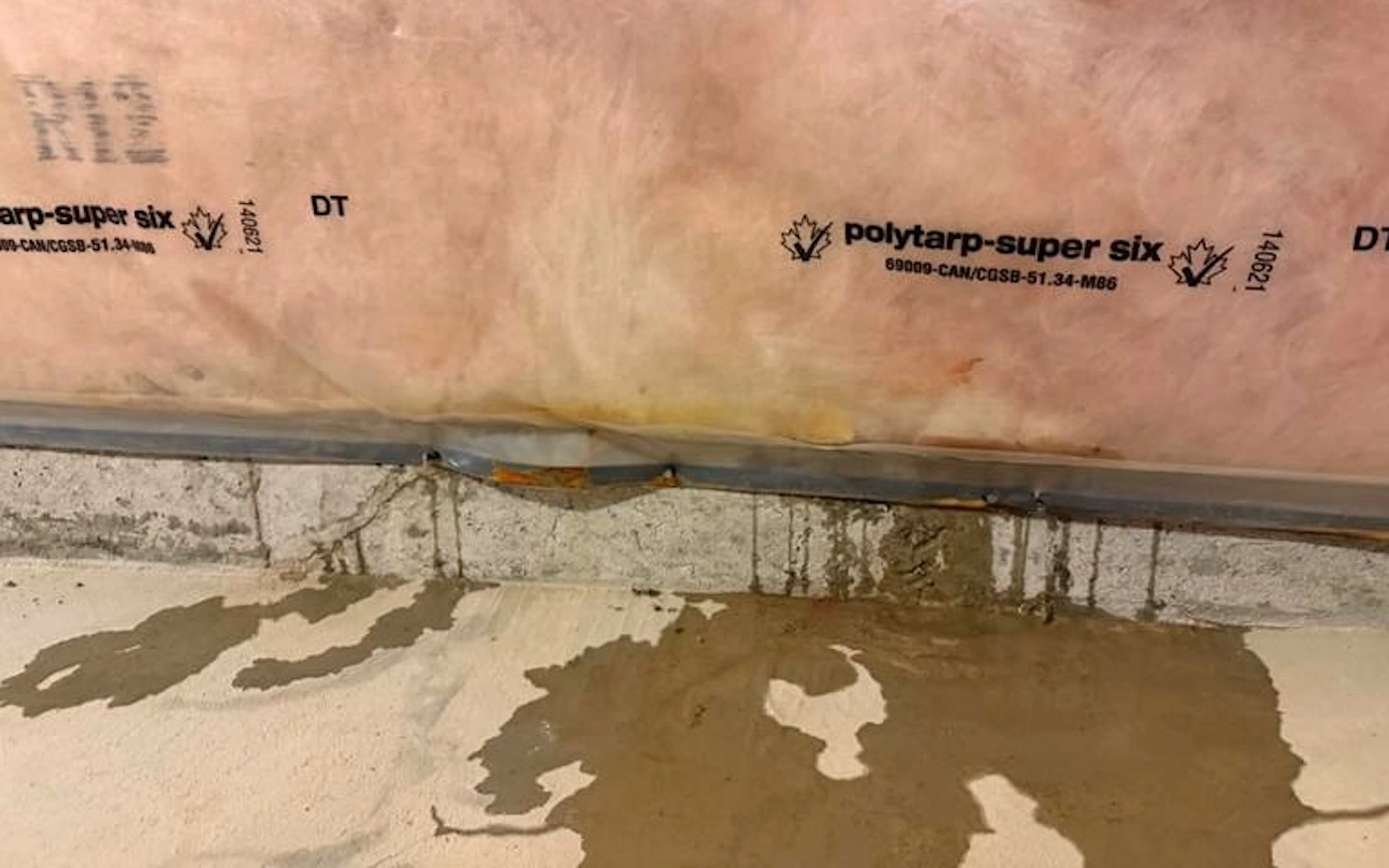 Water pooling on a concrete basement floor