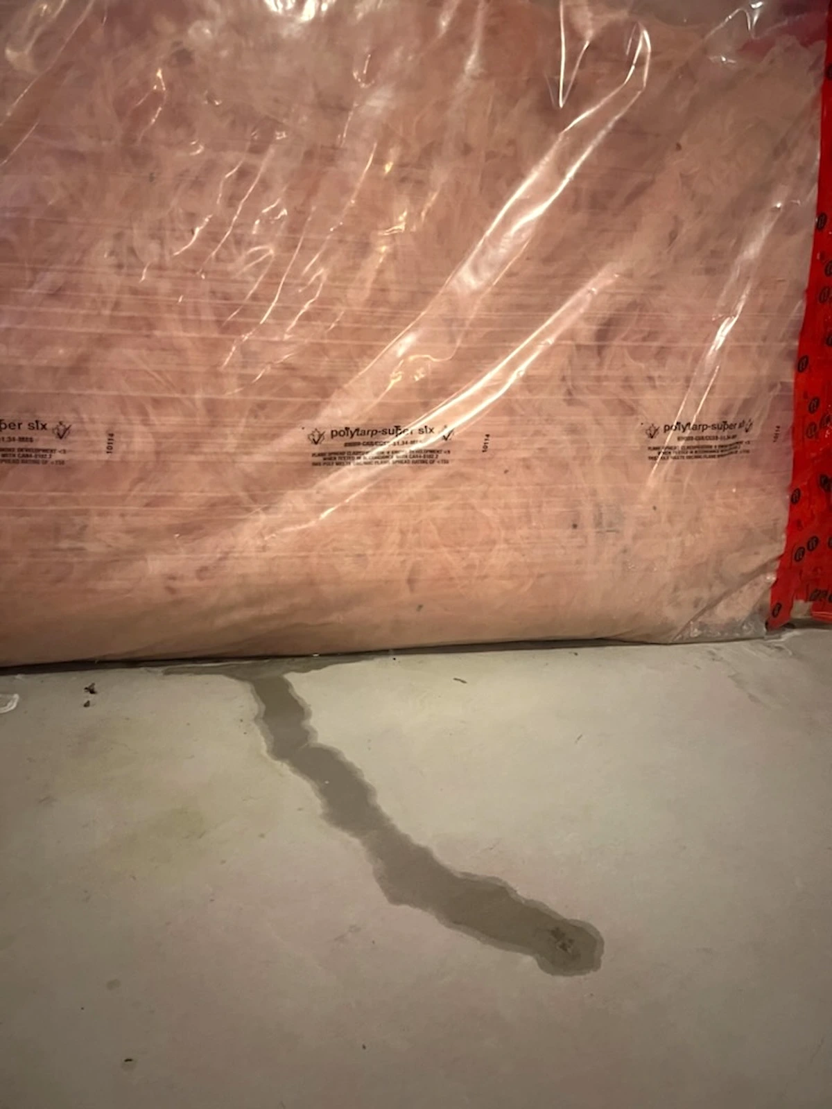 Water entering over the top of a poured concrete foundation wall